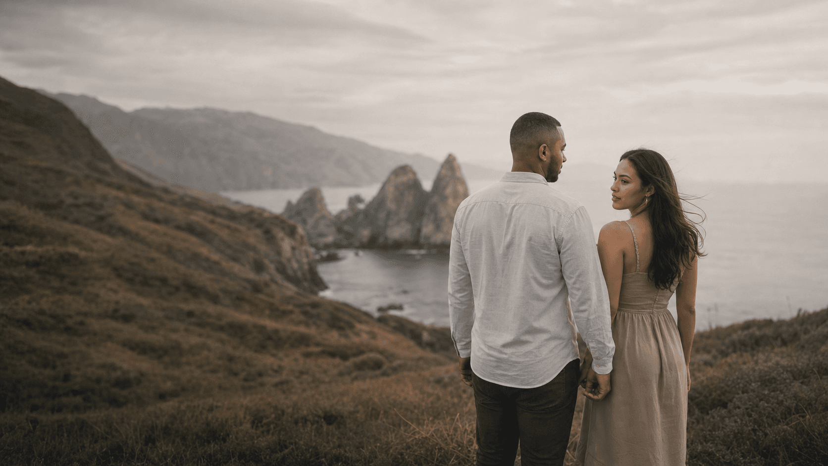 Couple photographed at a coastal overlook
